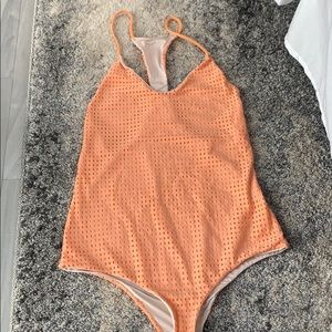 Peach/orange colored One piece mesh bathing suit